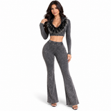 Model wearing the charcoal Fur The Night Flare Set with a black feather-trim cropped top and matching high-waisted flare pants on a white background.