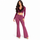 Model wearing the burgundy Fur The Night Flare Set with a feather-trim cropped top and matching high-waisted flare pants on a white background.
