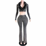 A mannequin wearing a dark gray long-sleeve crop top with a black faux-fur collar and matching dark gray flared pants, shown against a plain white background.