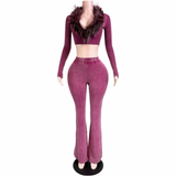 Front view of the Fur The Night Flare Set in washed burgundy, with a long-sleeve cropped top, feather-trim neckline, and matching flared pants on a mannequin.