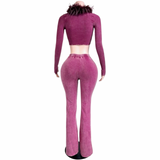Back view of the burgundy Fur The Night Flare Set showing the cropped long-sleeve top, feather-trim neckline, and matching flared pants on a mannequin.