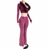 Side view of the burgundy Fur The Night Flare Set showing the cropped long-sleeve top, plush neckline trim, and matching flared pants on a mannequin.