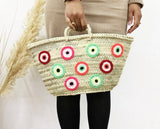 Small evil eye straw bag